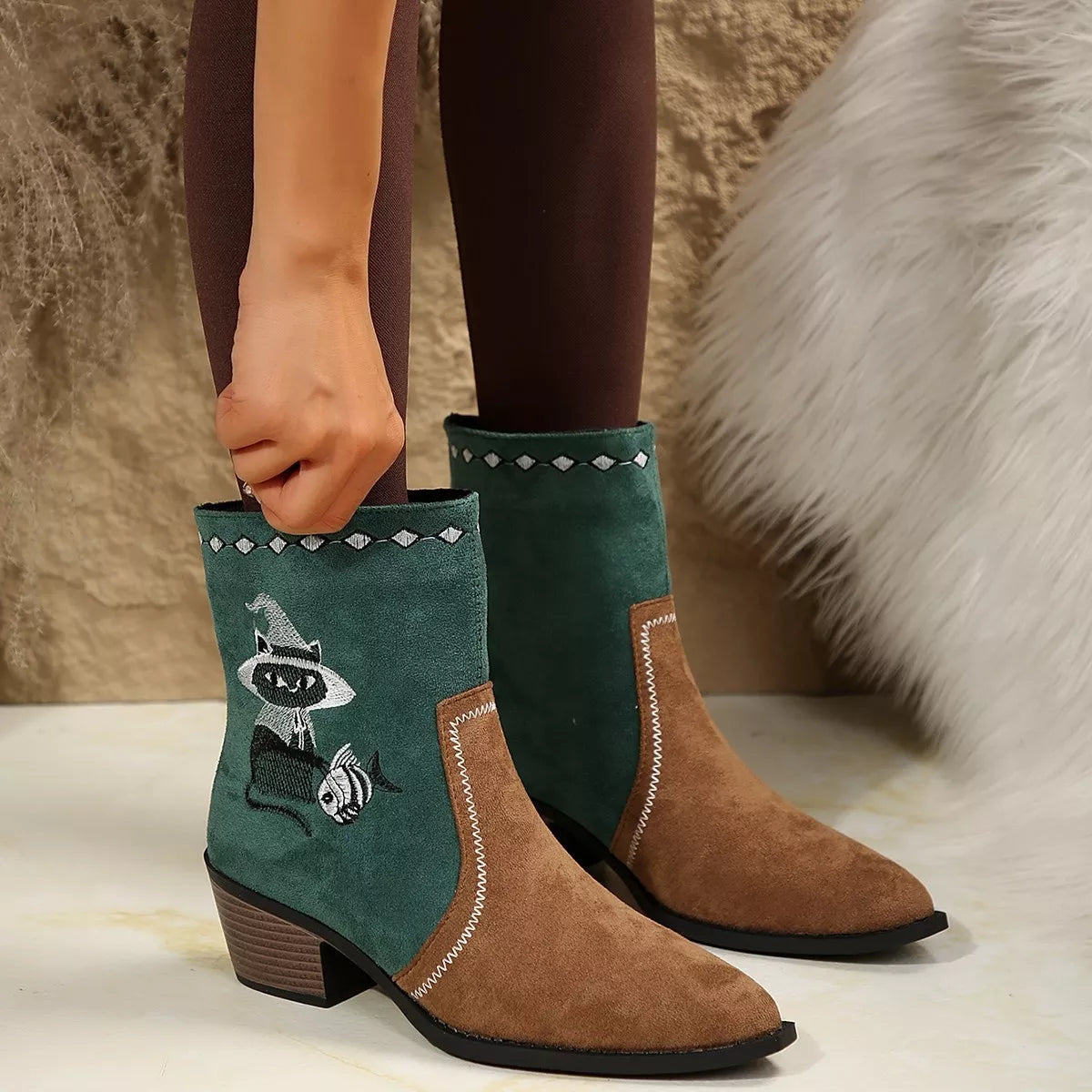 Black Western cowboy boots with embroidered design, trendy shoes by Trendsi featuring classic Western style and detailed stitching.