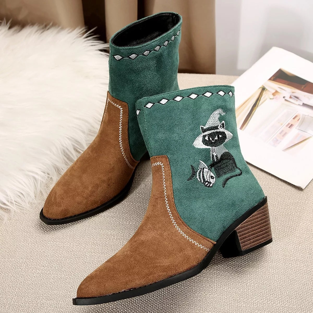 Black Western cowboy boots with embroidered design, trendy shoes from Trendsi featuring classic western style and detailed stitching.