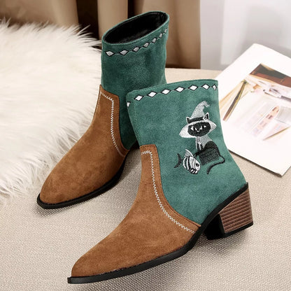 Black Western cowboy boots with embroidered design, trendy shoes from Trendsi featuring classic western style and detailed stitching.