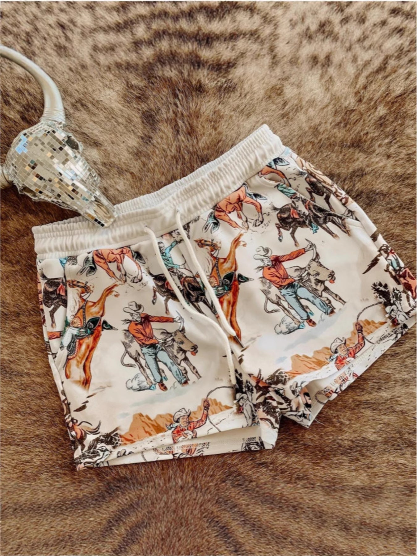 Wild West rodeo print drawstring shorts from Trendsi featuring a colorful western-themed design and comfortable fit.