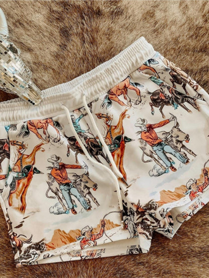 Wild West Rodeo print drawstring shorts by Trendsi featuring a cowboy-themed rodeo design and lightweight casual style.