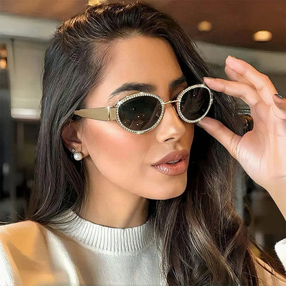 Oval sunglasses with rhinestone embellishments from Trendsi, featuring a stylish frame and sparkling decorative details.