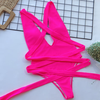 Hot pink Trendsi halter neck deep V tied one-piece swimsuit, featuring a stylish swimwear design with a flattering fit.
