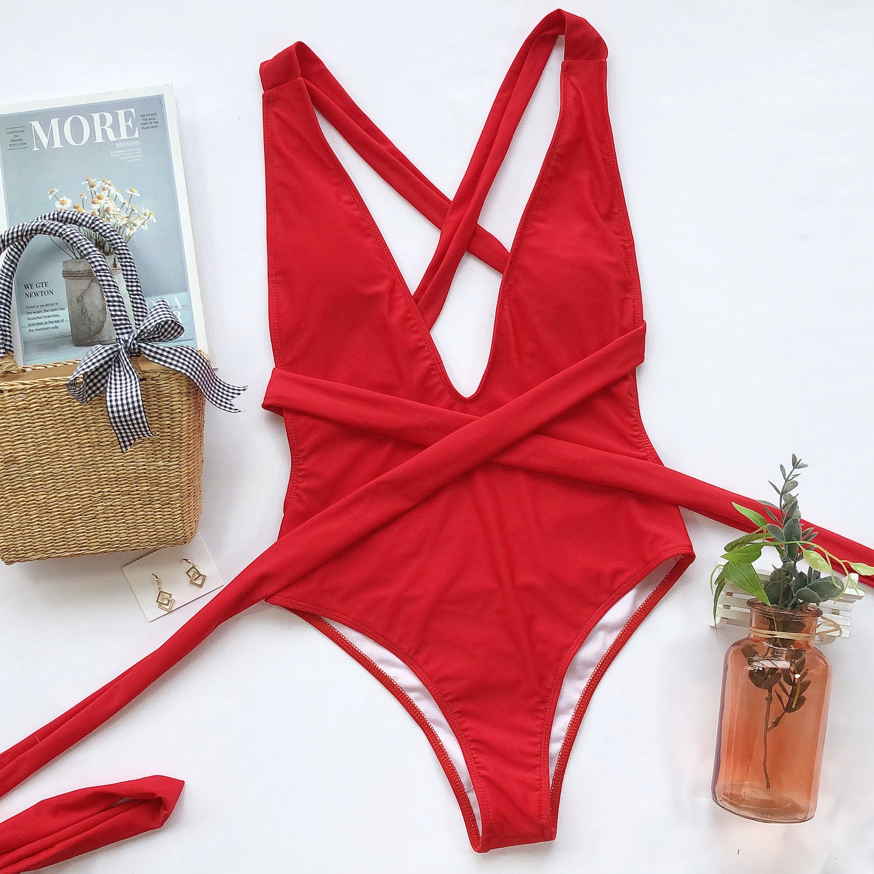 Hot pink Trendsi halter neck deep V tied one-piece swimsuit, featuring a stylish swimwear design with a plunging neckline.