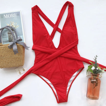 Hot pink Trendsi halter neck deep V tied one-piece swimsuit, featuring a stylish swimwear design with a plunging neckline.