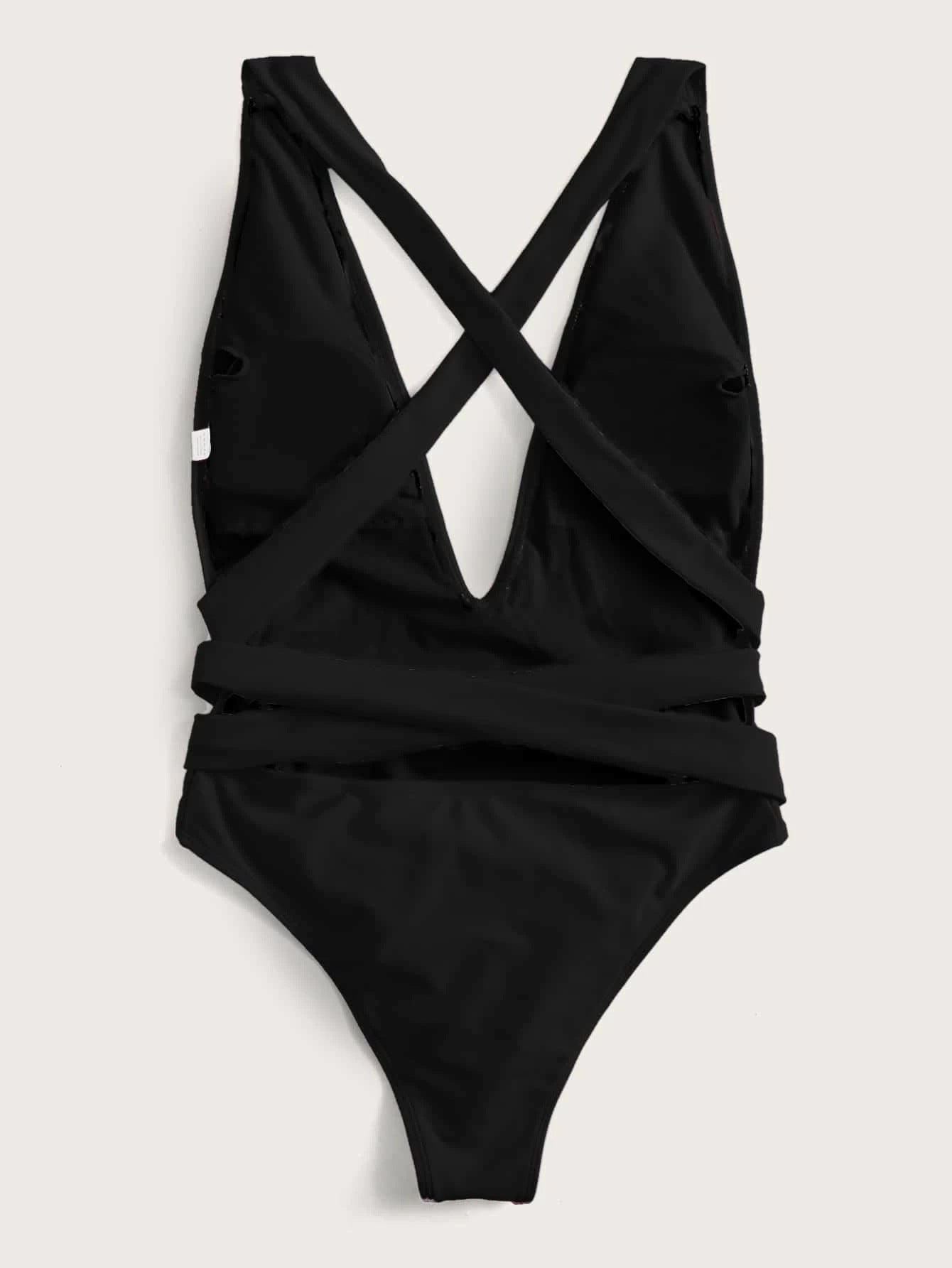 Hot pink halter neck deep V tied one-piece swimsuit from Trendsi, featuring stylish swimwear design with adjustable straps.