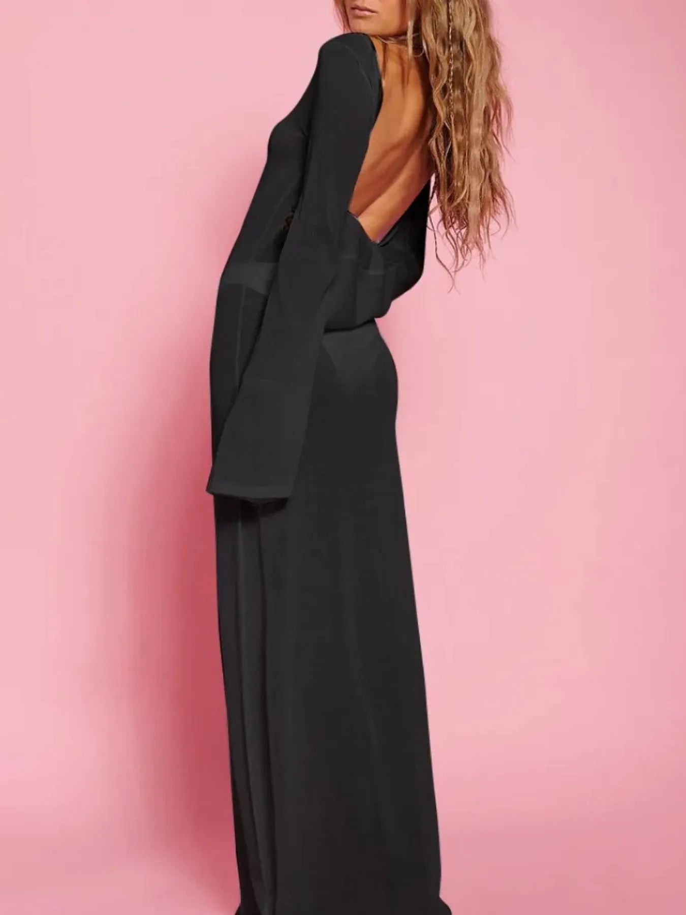 White backless long sleeve maxi cover-up for swimwear by Trendsi, featuring a flowing, elegant design perfect for beachwear.