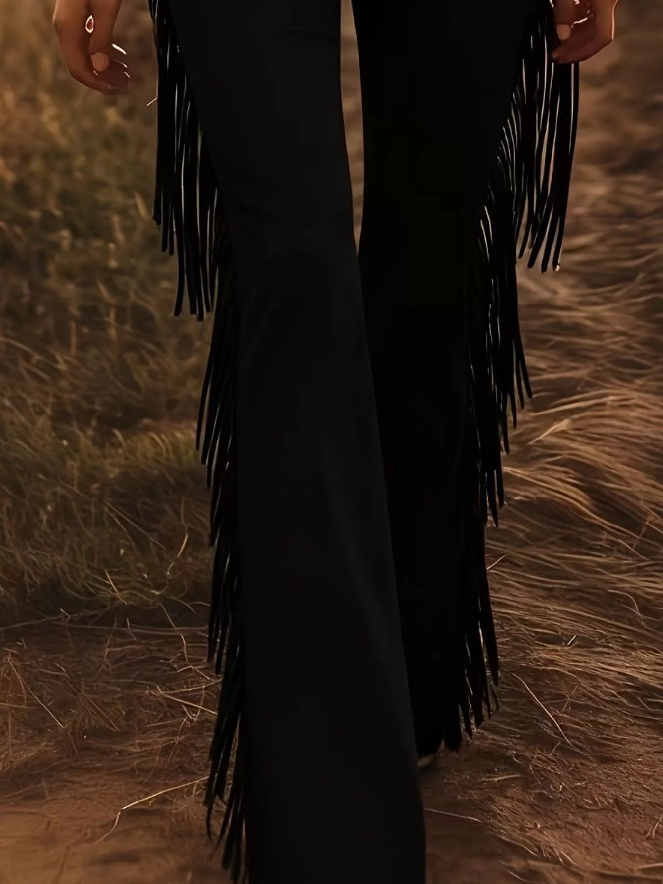 Trendsi fringe trim flare pants with flowing fabric and decorative fringe detail on the hem, stylish and bohemian-inspired.