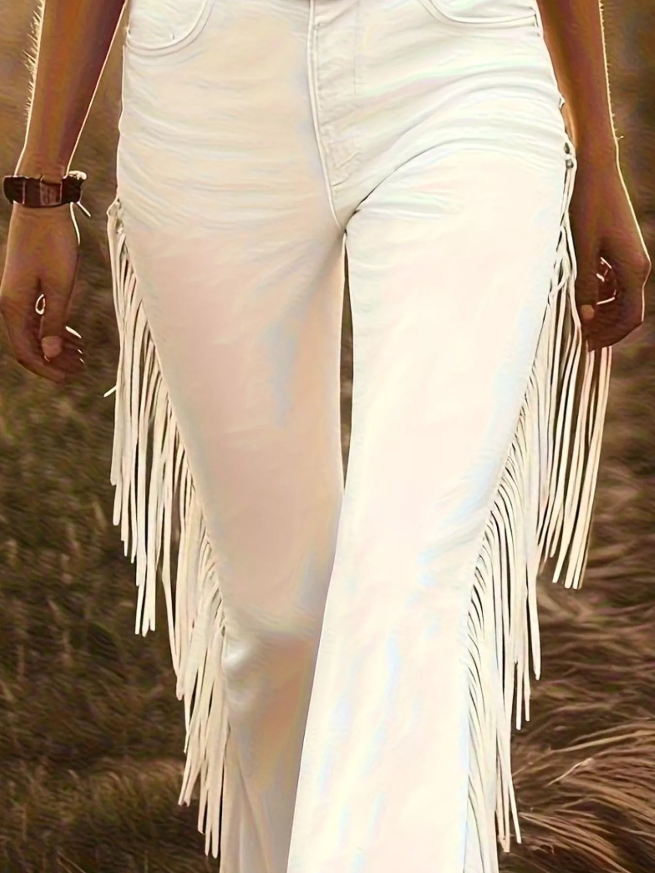 Flare pants with fringe trim from Trendsi featuring wide legs and boho style, shown in a stylish fashion pose.