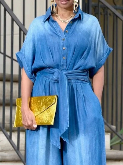 Vintage blue denim jumpsuit with button front and wide-leg design by Trendsi, featuring a casual, relaxed fit.