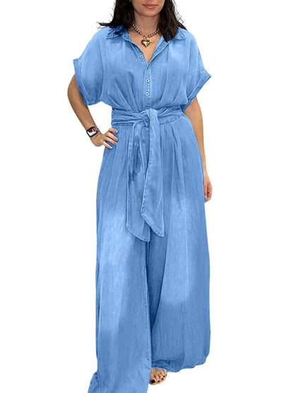 Vintage blue denim jumpsuit with button front and wide-leg design, by Trendsi, shown on a model.