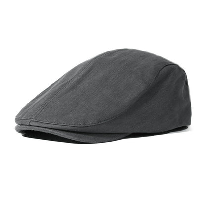 Stylish classic solid color newsboy cap from Trendsi, featuring a rounded crown and short brim for a vintage-inspired look.