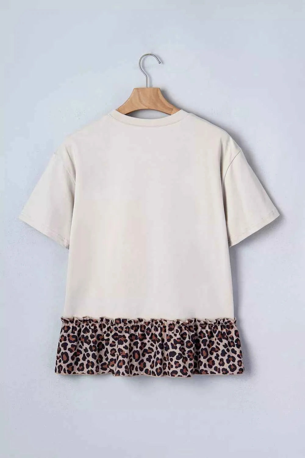 White cowgirl print leopard ruffle T-shirt from Trendsi, featuring bold style and comfortable fit.