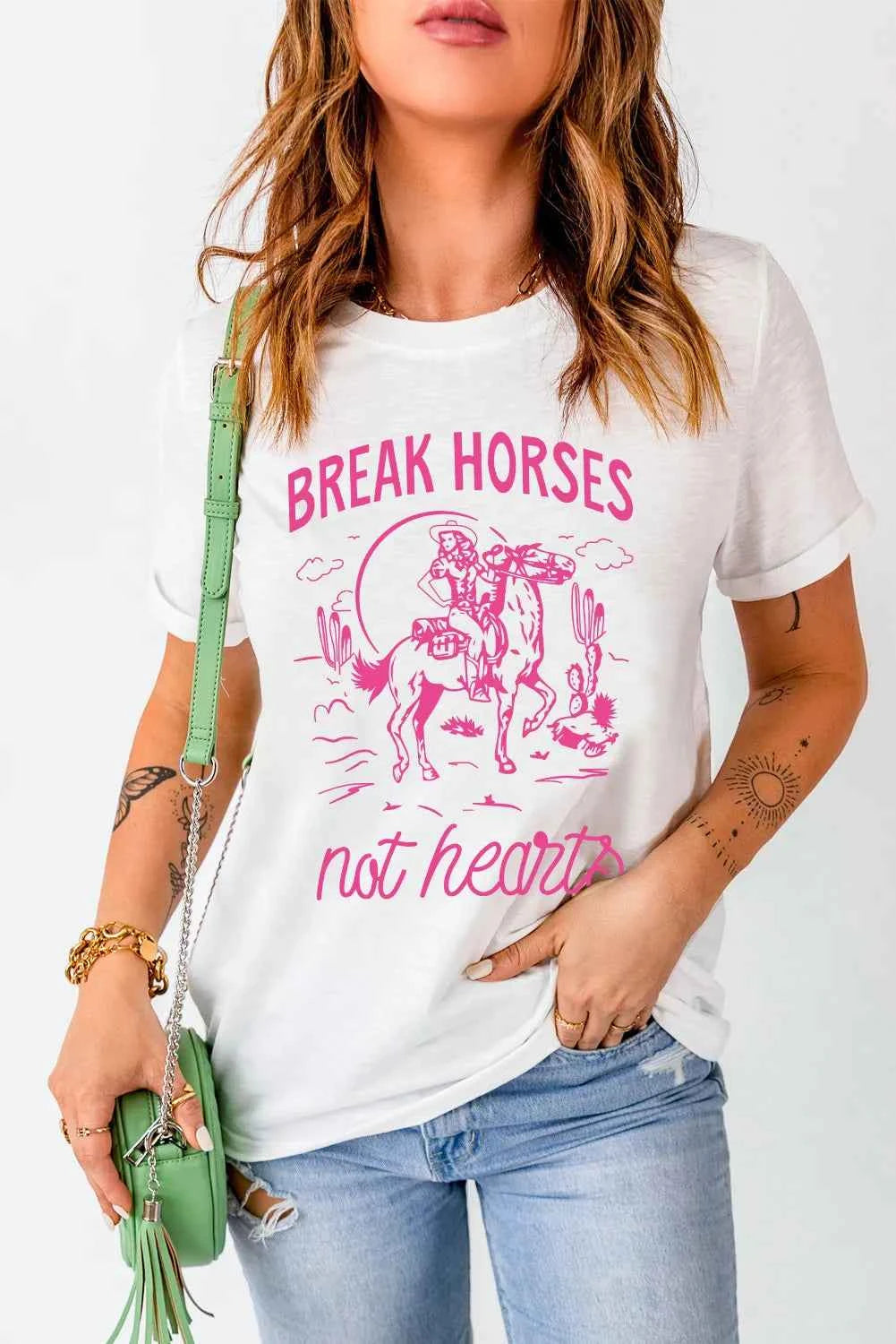 White graphic round neck T-shirt from Trendsi featuring a stylish design, perfect for everyday casual wear.