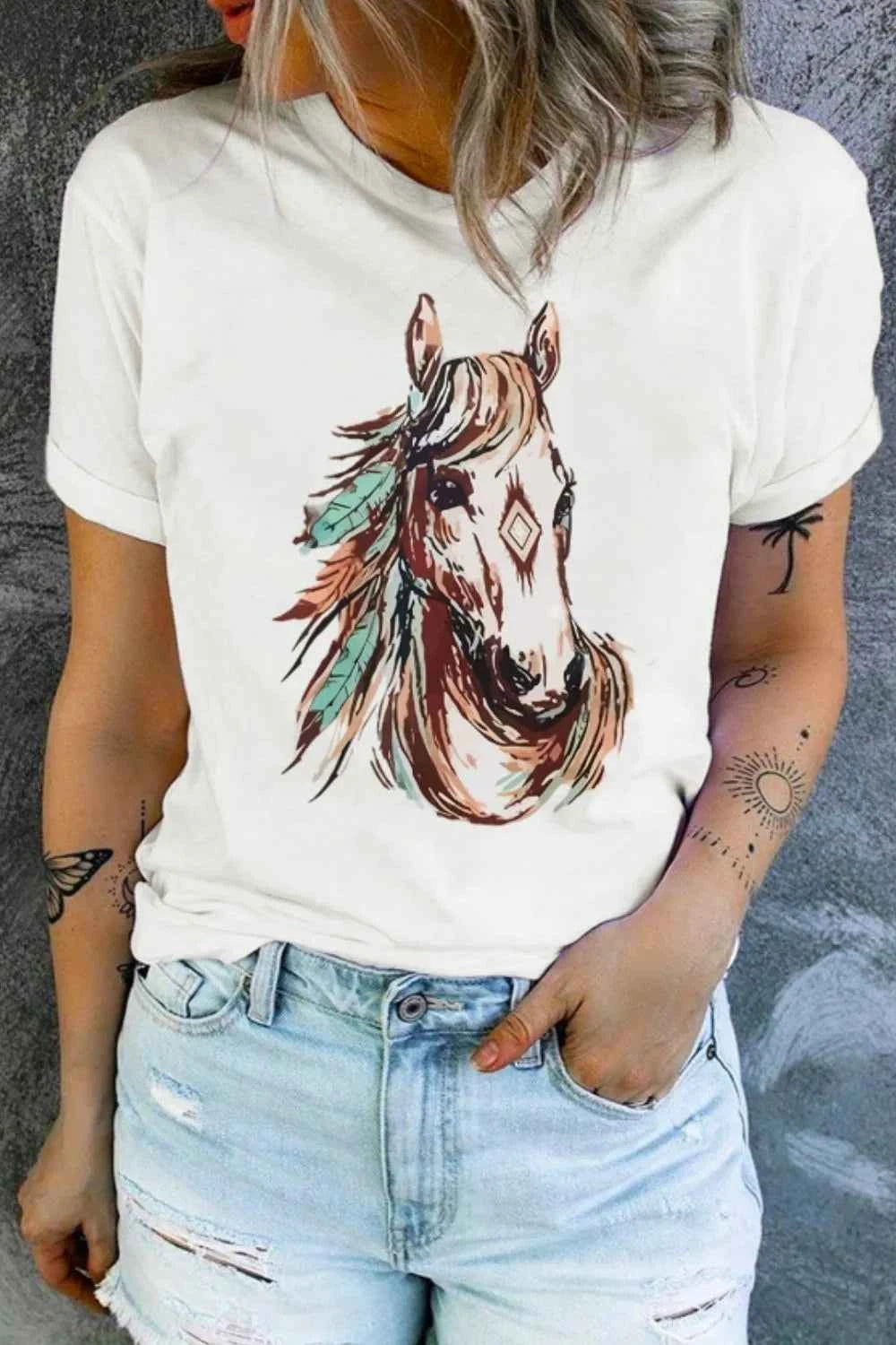 White Western Aztec Horse Graphic Tee by Trendsi featuring a bold horse and Aztec design on soft cotton fabric.