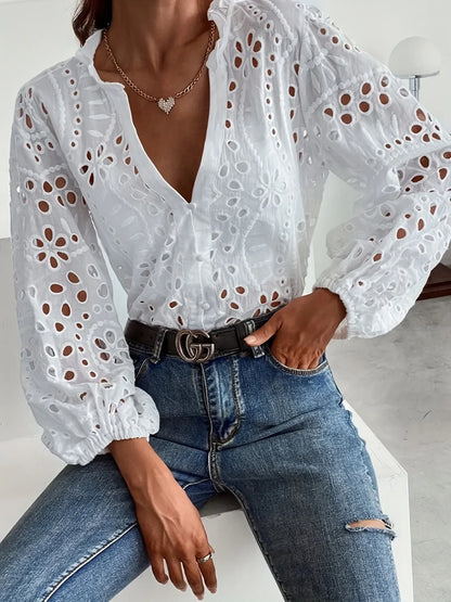 White eyelet embroidered button front shirt with puffed sleeves by Trendsi, featuring intricate embroidery and a stylish, feminine silhouette.