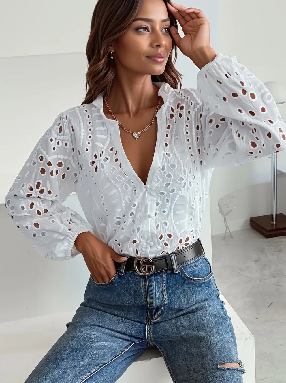 White eyelet embroidered button-front shirt with puffed sleeves from Trendsi, showcasing intricate embroidery and feminine puffed sleeve design.