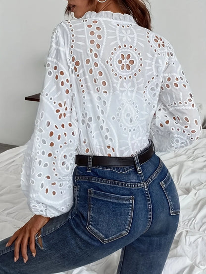 White eyelet embroidered button front shirt with puffed sleeves from Trendsi, detailed floral embroidery and feminine puffed sleeve design.