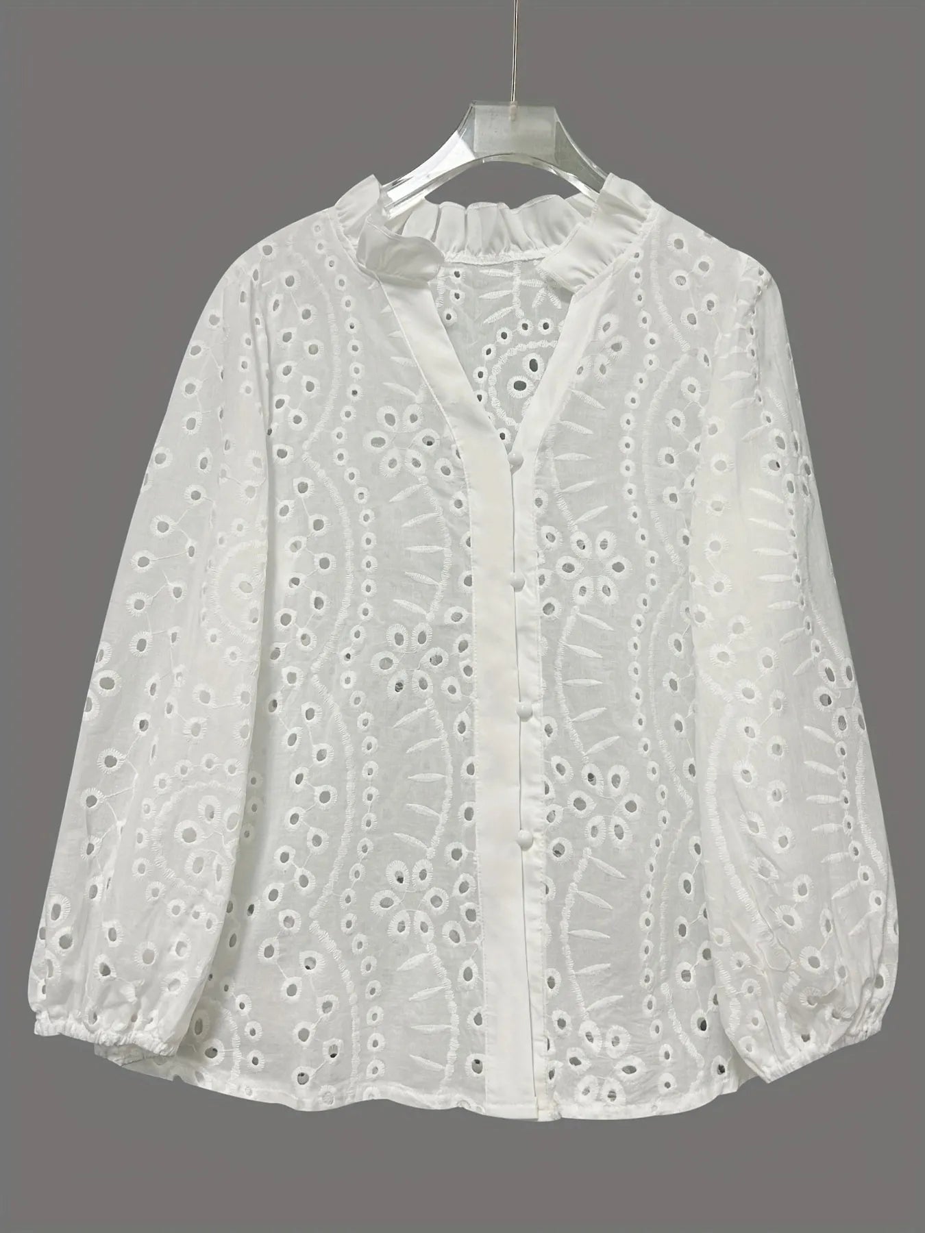 Eyelet embroidered button-front shirt with puffed sleeves, stylish Trendsi women's top featuring delicate detailing and a feminine fit.