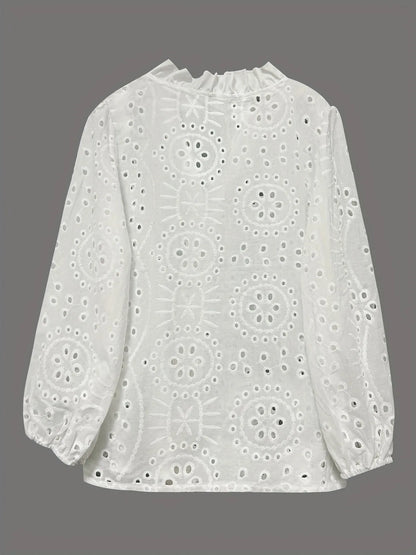 Eyelet embroidered button-front shirt with puffed sleeves, stylish and feminine, featuring intricate embroidery and a classic fit.