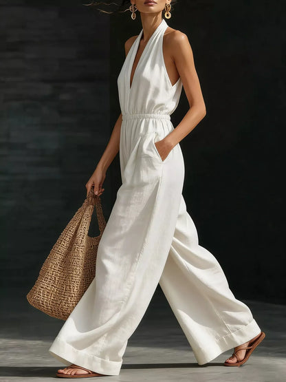 White full-size halter neck wide-leg jumpsuit from Trendsi, featuring a stylish plus size design and comfortable fit.