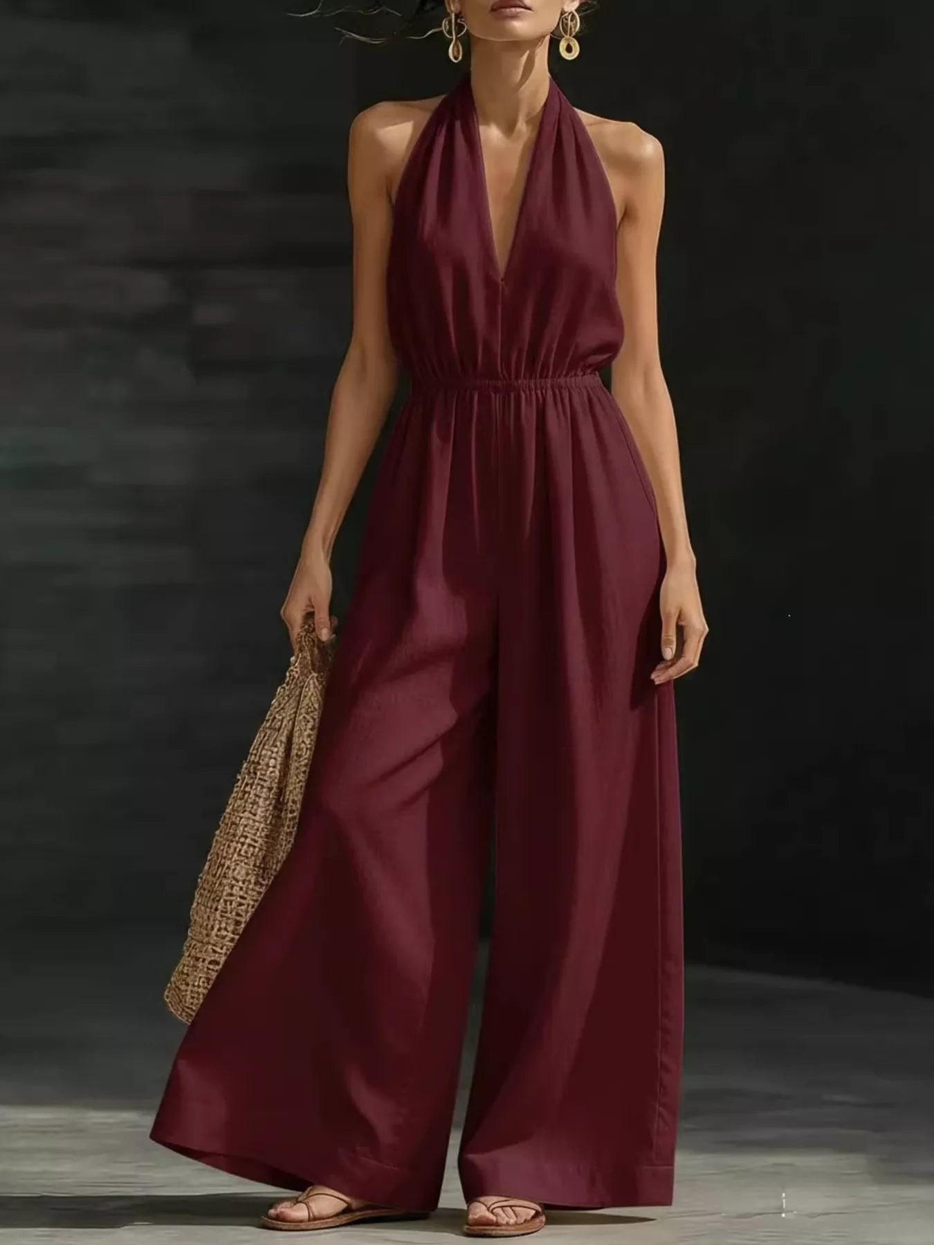 White plus size halter neck jumpsuit with wide-leg design, full-length, by Trendsi, perfect for stylish, comfortable wear.