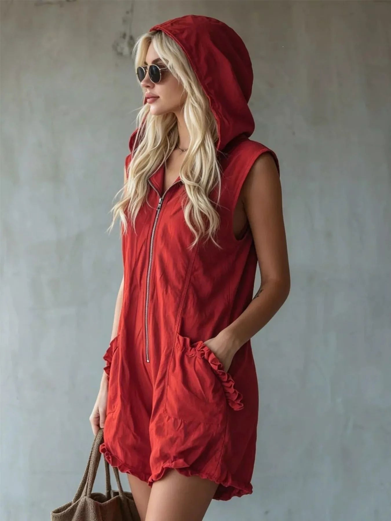 White plus size hooded sleeveless zipper romper with ruffled pockets, casual and stylish by Trendsi.