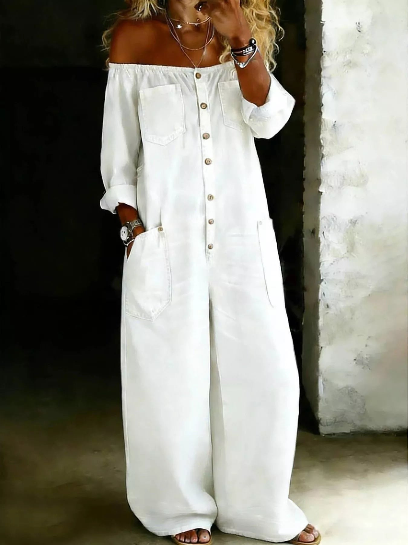 White plus size off-shoulder button-down jumpsuit with wide-leg silhouette, from Trendsi, styled for a chic, relaxed look.