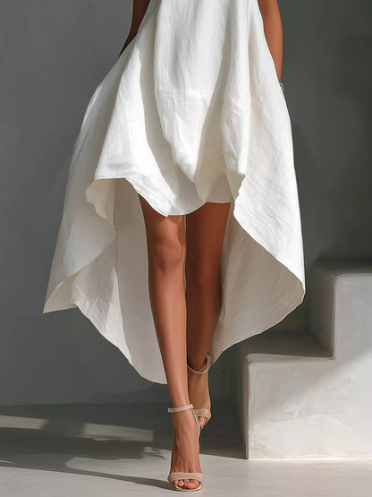 White high-low sleeveless dress with round neckline from Trendsi, displayed on a hanger.