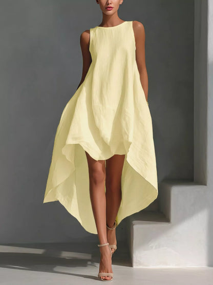 White high-low sleeveless dress with round neckline by Trendsi, shown on a model with flowing fabric and stylish design.