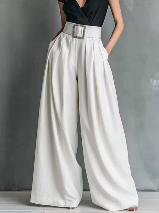 High-waisted wide-leg pants from Trendsi, featuring a flowy silhouette and tailored fit, shown in a neutral fabric.
