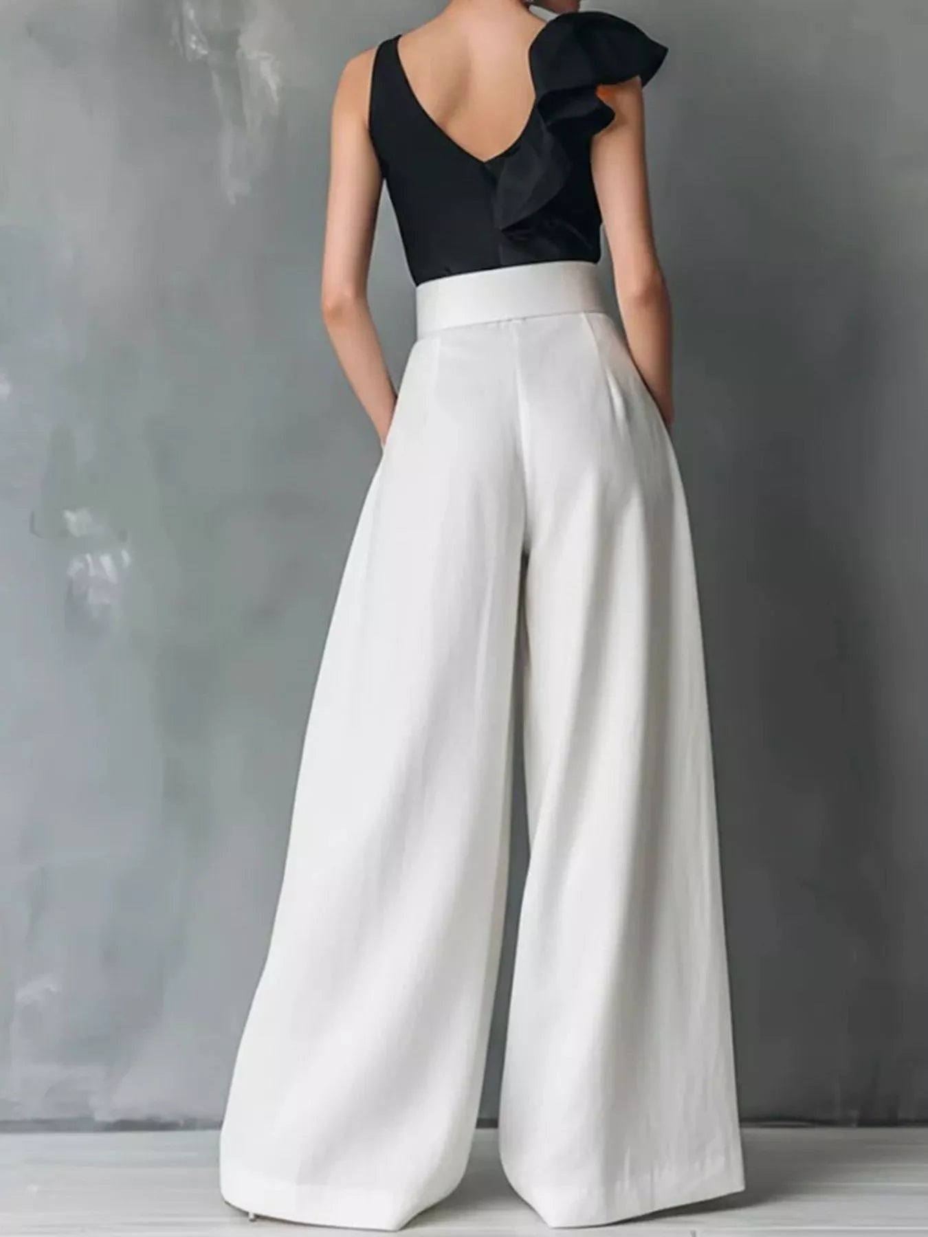 High-waisted wide-leg pants from Trendsi, featuring a flowy fit and tailored waistband, shown in a natural pose.