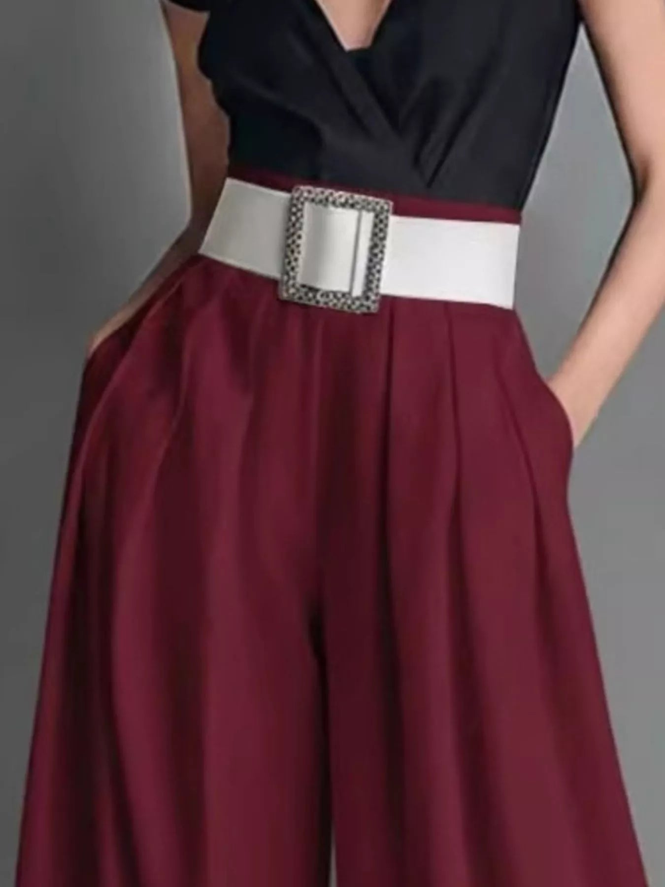 High-waisted wide-leg pants from Trendsi, featuring a flowy fit and structured waistband in a neutral fabric.