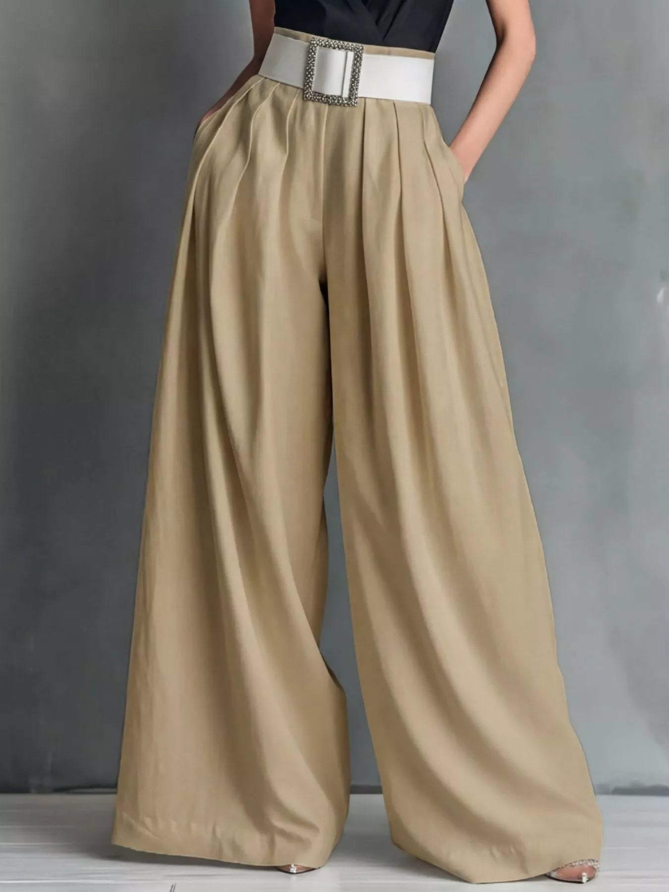 High-waisted wide-leg pants from Trendsi, showcasing a relaxed fit, flowing fabric, and stylish design on a neutral background.