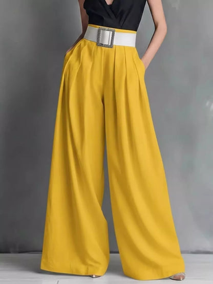 High-waisted wide-leg pants by Trendsi featuring a flowy fabric and relaxed fit, displayed on a neutral background.