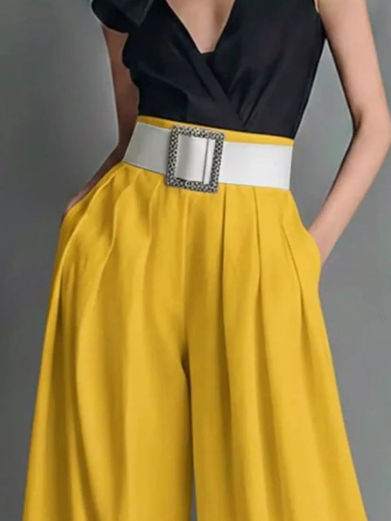 High-waisted wide-leg pants from Trendsi displayed on a hanger, showcasing their flowy, relaxed fit and stylish silhouette.