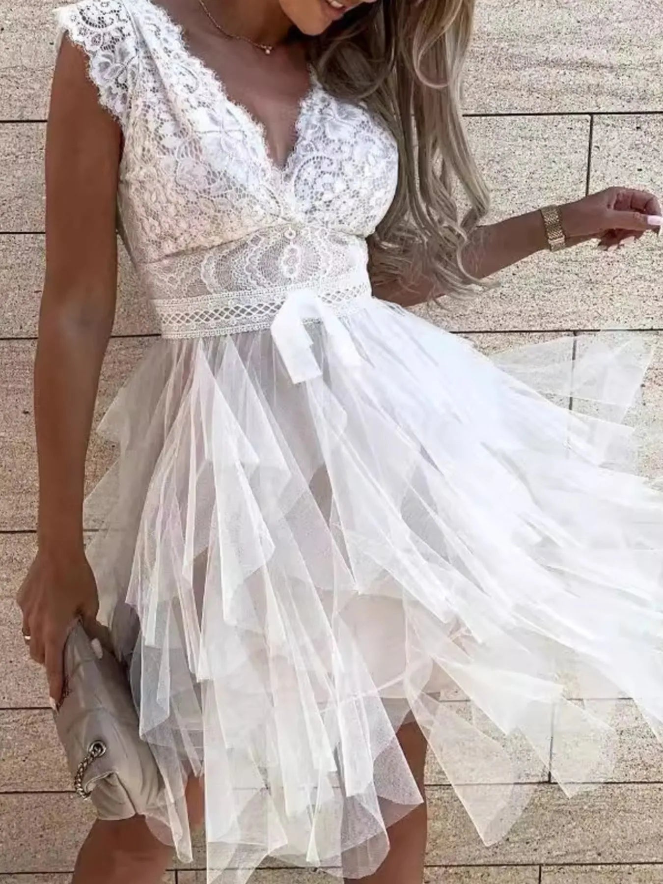 Lace V-neck ruffle dress by Trendsi featuring delicate lace fabric, V-neckline, and layered ruffle details on a stylish dress.
