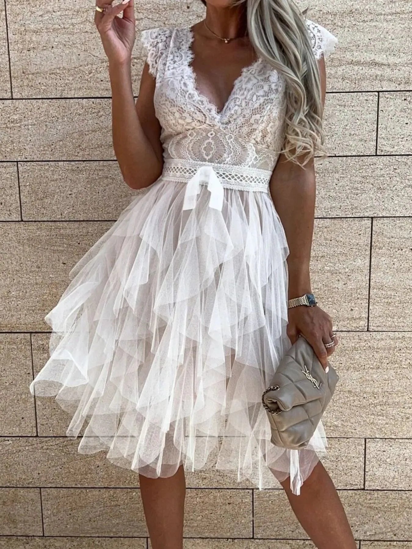 Lace V-neck ruffle dress by Trendsi featuring delicate lace fabric and a stylish V-shaped neckline with ruffle detailing.
