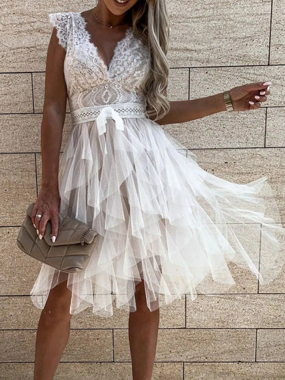 Lace V-neck ruffle dress by Trendsi featuring delicate lace fabric, V-neckline, and ruffled details for a feminine, stylish look.