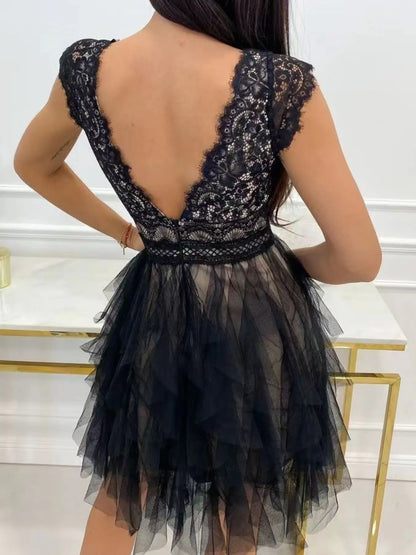 Lace V-neck ruffle dress by Trendsi featuring delicate lace fabric and flowing ruffle details on the neckline.