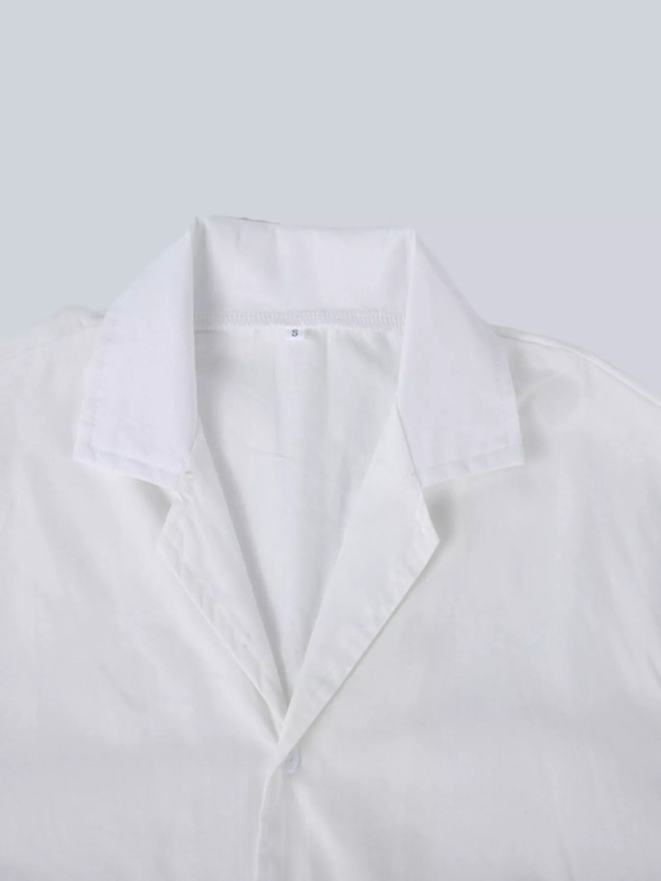 Men's plus size casual short-sleeve shirt by Trendsi in white, featuring a relaxed fit and breathable fabric.