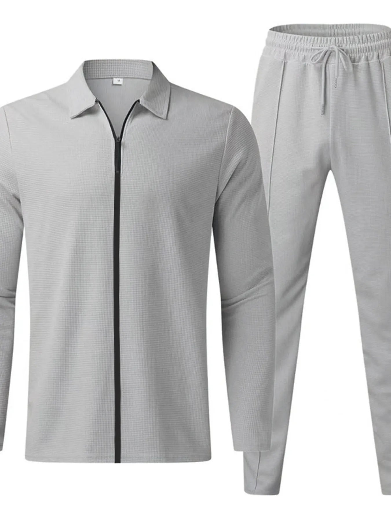Men's plus size white zip-up top and pants set by Trendsi, casual and comfortable full-length athletic loungewear.