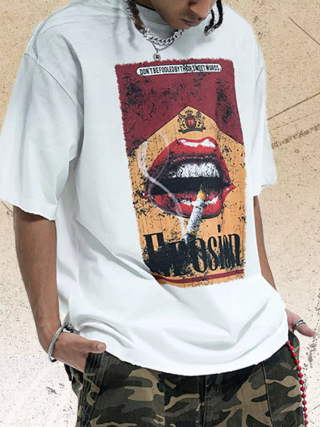 White men's graphic round neck half-sleeve T-shirt by Trendsi with bold graphic design on front, casual and stylish fit.