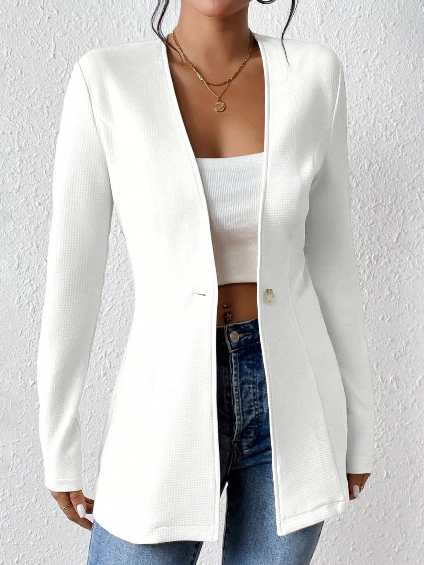 Black one-button long sleeve blazer by Trendsi, tailored fit with lapel collar and sleek design, ideal for professional or casual wear.