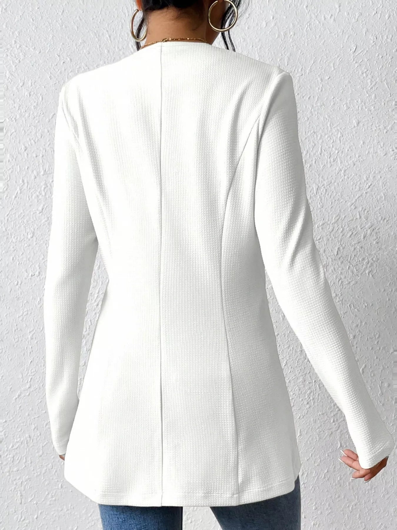 Black one-button long sleeve blazer from Trendsi, featuring a tailored fit and classic lapel, suitable for professional or casual wear.