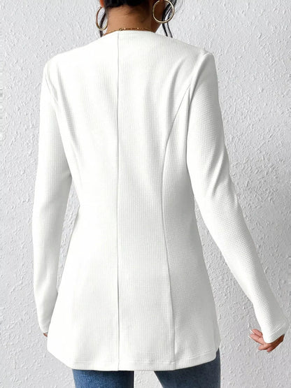 Black one-button long sleeve blazer from Trendsi, featuring a tailored fit and classic lapel, suitable for professional or casual wear.