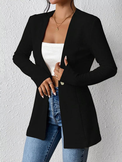 Black one-button long sleeve blazer from Trendsi, tailored fit with lapel collar and structured design, suitable for business or casual wear.