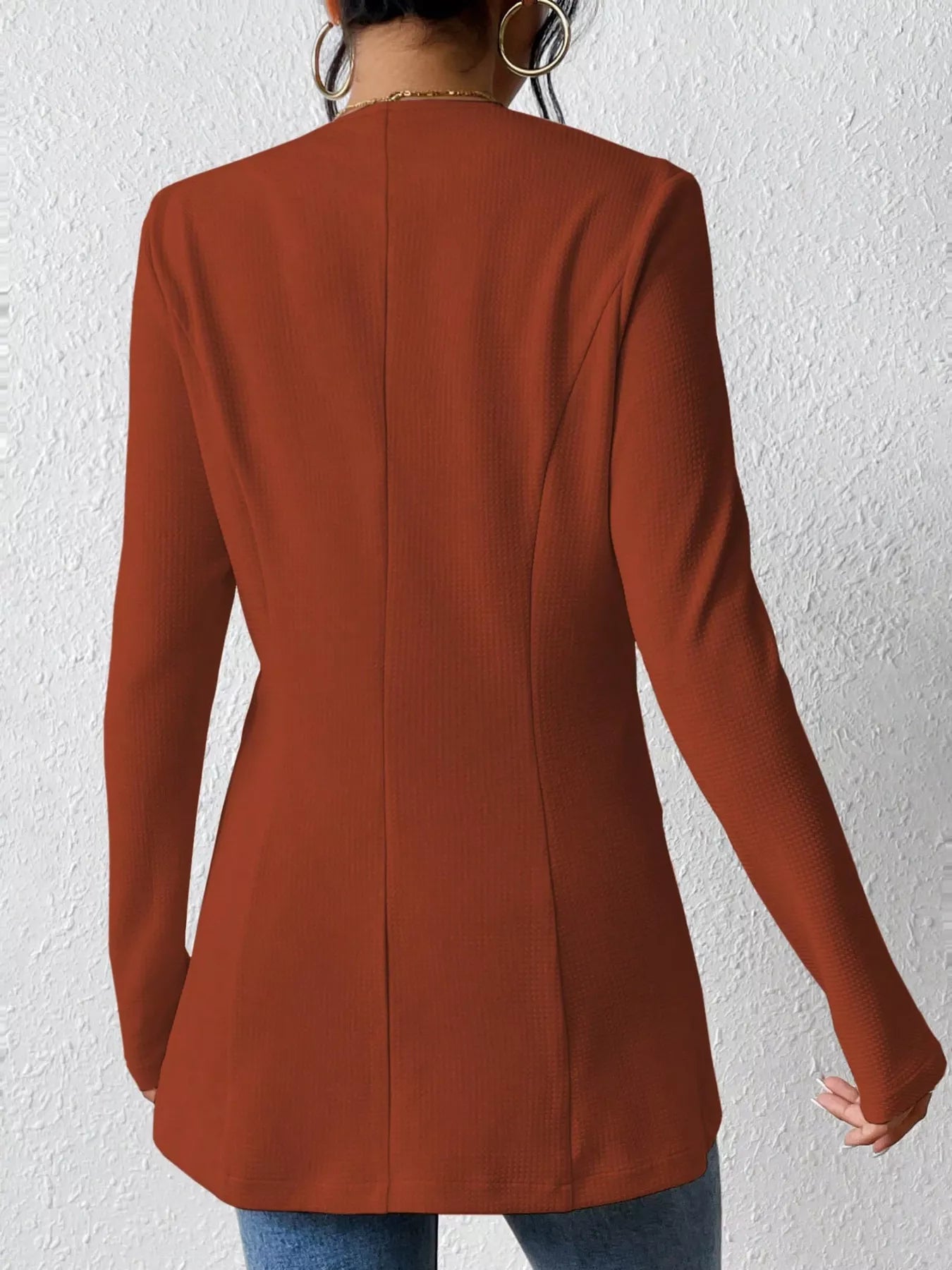 Black one-button long sleeve blazer by Trendsi featuring a tailored fit and classic lapel, displayed on a mannequin.