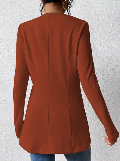 Black one-button long sleeve blazer by Trendsi featuring a tailored fit and classic lapel, displayed on a mannequin.