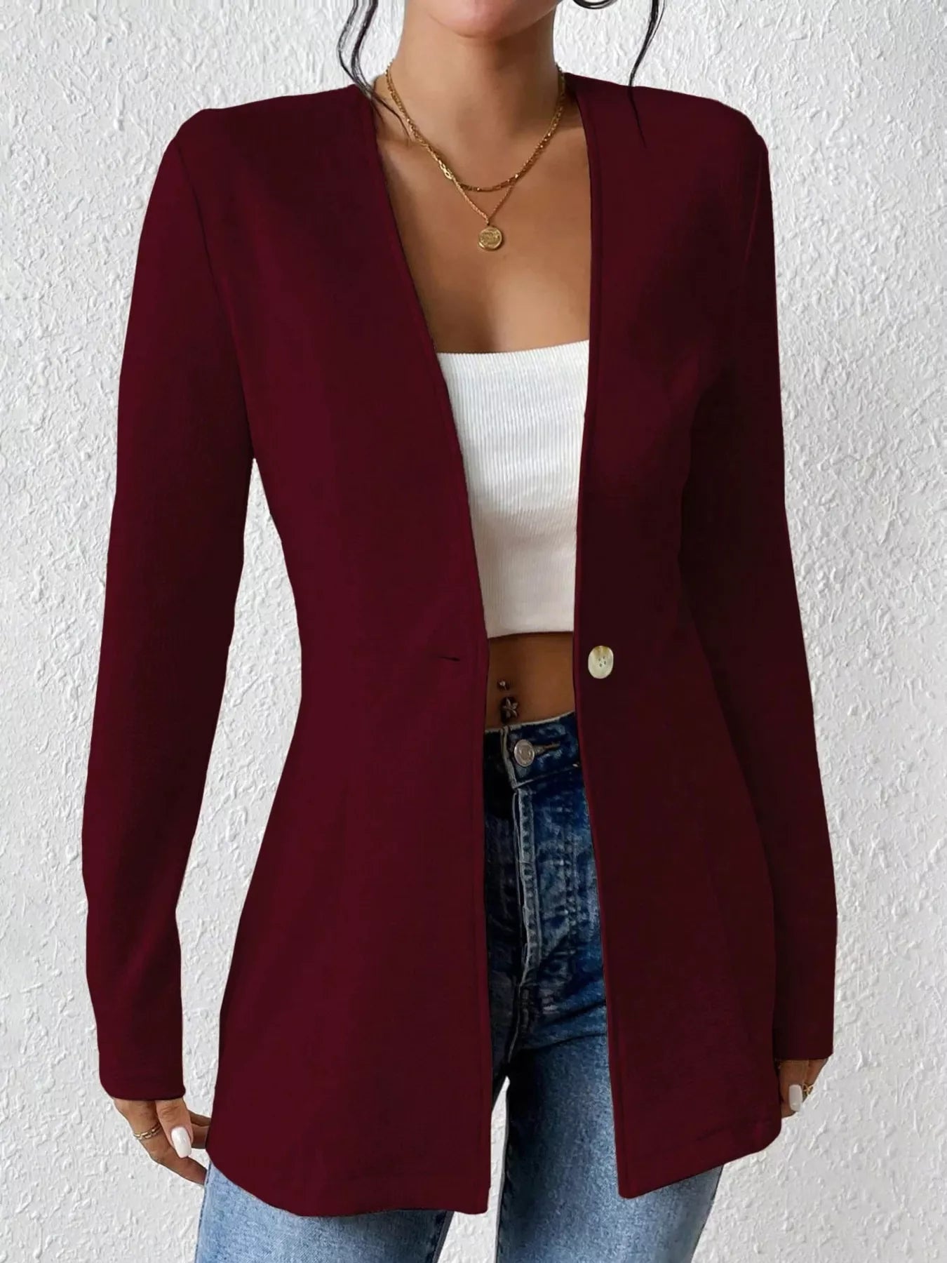 Long sleeve blazer with a single button from Trendsi, featuring a tailored fit and classic style in a neutral color.
